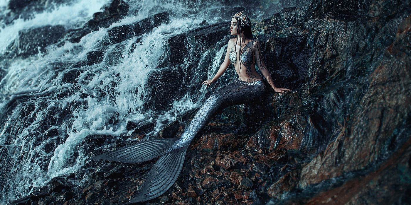 mermaid on rocks